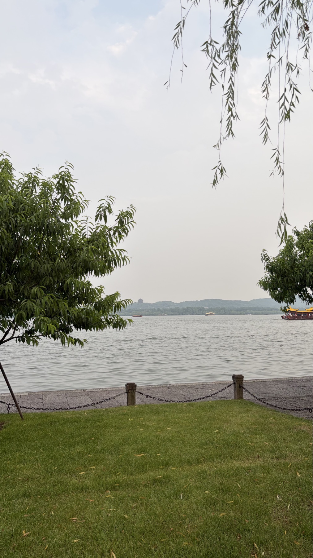 Cloudy West Lake view from a path
